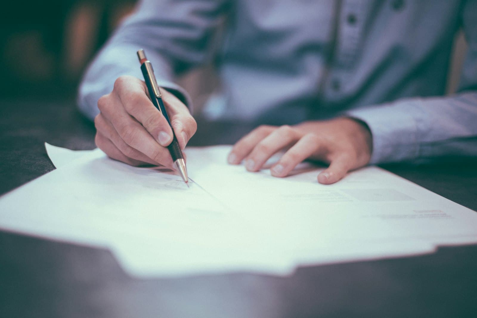 Public-sector administrators reviewing procurement and tender paperwork